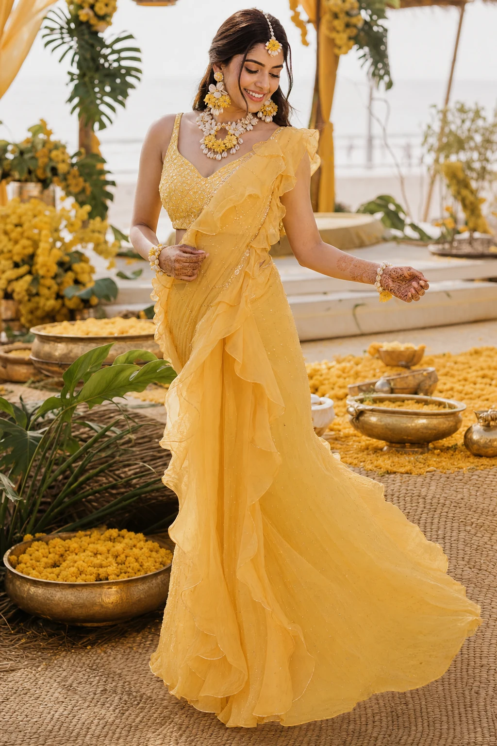 Indian bride in a light ruffled haldi saree with shell jewellery